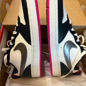Stylish Black and White Nike Sneakers with Pink Soles